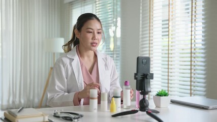 Asia woman people anti aging expert modern health vlogger live advice talk selfie video mobile phone camera. Online digital seller asian small SME store shop owner side hustle filming sell skin care.