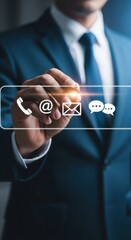 Executive using stylus with futuristic holographic interface. Businessman interacting with digital contact icons in hologram. Modern professional using glowing tech interface for communication.