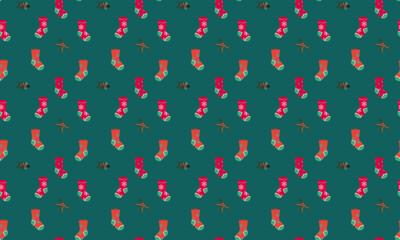 Seamless vector pattern with red Christmas stockings, holly leaves and fruits