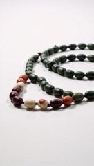Obraz premium High-resolution image of beads on a white background for jewelrycraft purposes