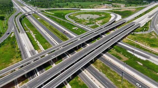 Aerial view drone footage of a complex bridge intersection where multiple highway numbers 290 and 304 Nakhon Ratchasima Thailand