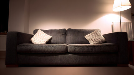 A contemporary sofa with textured pillows in a minimalist living space, creating a cozy and inviting atmosphere.