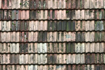 Roofing made of antique tiles in different shades