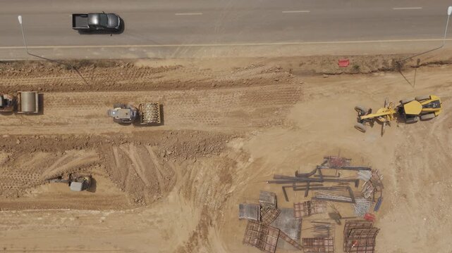 Aerial view drone footage of bridge construction being made across the intersection