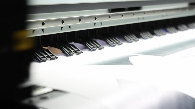 High resolution Industry printer. Industrial inkjet printer in operation. printing patterns on large sheet of fabric or paper. Automate printer for modern textile printing and digital print technology