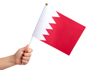 A hand holds the national flag of Bahrain, a symbol of the country's national identity.