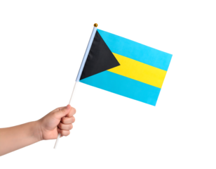 A hand holding the national flag of the Bahamas.