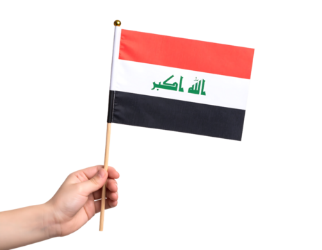 A hand holding the national flag of Iraq.