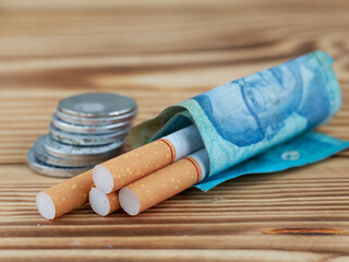 Cigarettes smoking cost and budget money loss with tobacco addiction. Stop smoking concept 