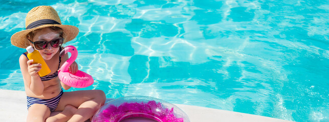 The child has sunscreen on his face. Selective focus.