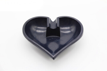 Heart shaped ashtray, isolated on a white background	
