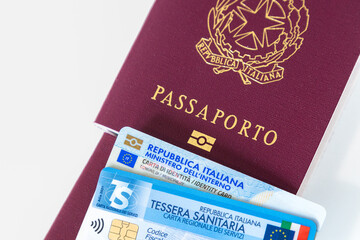 Italy - Close-up of Italian documents for identification and healthcare: passport, ID card, and...