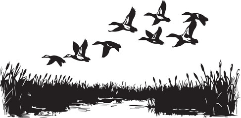 Silhouette of ducks flying over a marsh with cattails and water flock migration