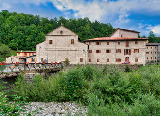 Fototapeta premium Fiumalbo (Modena, Italy), 17th-century church of Saints Donnino and Francesco with the former seminary attached.