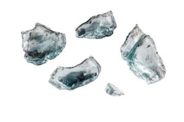 Scattered, translucent, icy rocks.  A cluster of irregular, crystalline shapes, varying in size and hue, against a black backdrop.  Soft, light teal-gray color gradations