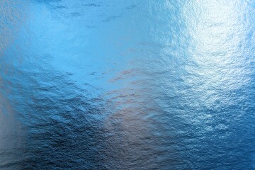 A shimmering blue surface reflects light, creating a tranquil and serene water-like effect.