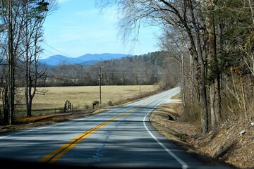 road with mountains in the background