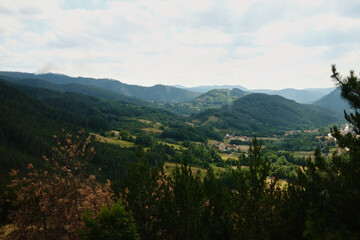 Obraz premium Scenic mountain valley landscape near Mokra Gora, Serbia, viewed from the train.