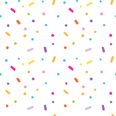Whimsical seamless pattern of colorful sprinkles and dots on a clean white background for decorations