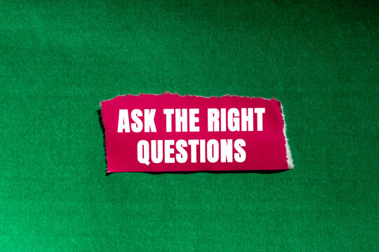 Ask The Right Questions message written on ripped torn pink paper piece on green background. Conceptual Ask The Right Questions symbol. Copy space.