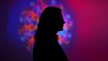 Silhouette of Woman with Vibrant Abstract Light Halo