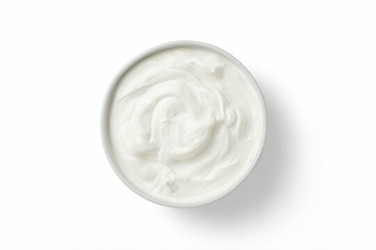a bowl of yogurt on a white surface