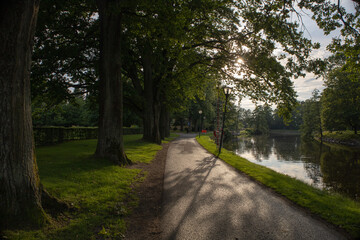 Scenic view of Orebro parks next to the flowing creek surrounded by natural greenery in central Sweden Orebro County