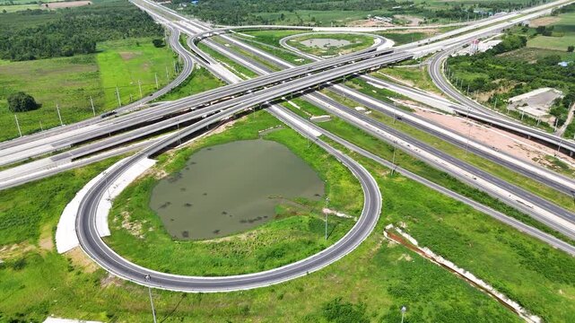 Aerial view drone footage of a complex bridge intersection where multiple highway numbers 290 and 304 Nakhon Ratchasima Thailand