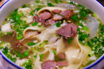 beef noodle soup with flat noodles. Chinese food