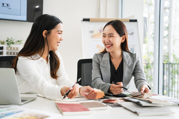 Woman architect designer teamwork select material compare samples finishing. Female interior creator choosing renovation materials with swatch spectrum.