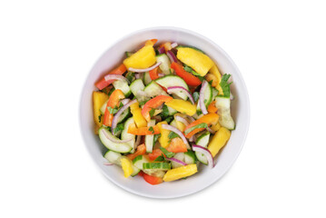 Cucumber red onion mango red bell pepper salad in a bowl on a white isolated background