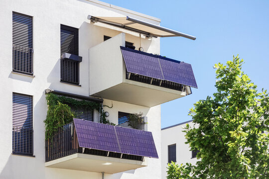 Balcony Solar Panel Station of Modern Residential Apartment Building. Photovoltaic Modules on balcony Railings.