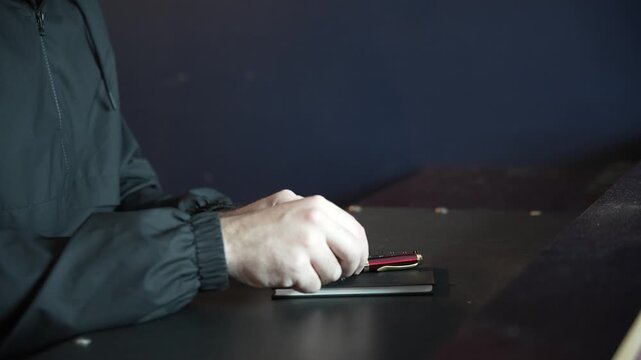 Hands Writing in Notebook &ndash; Close-Up of Manual Notes and Planning