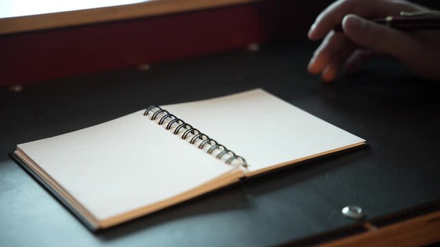 Hands Writing in Notebook &ndash; Close-Up of Manual Notes and Planning