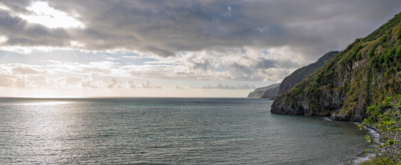 Dramatic Madeira Coastal Cliffs and Atlantic Ocean Under Moody Sky