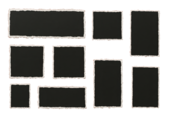 the image shows several dark rectangular and square shapes arranged on a red surface. the shapes appear to be framed with white borders that have a torn or jagged edge