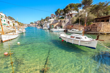 Fototapeta premium Cala Figuera Bay with boats in turquoise blue water and typical Mallorcan buildings on the popular island of Mallorca in Spain