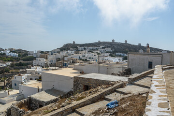 Fototapeta premium Windmills of Chora – Cycladic Icons Viewed from the Castle of Amorgos, Greece
