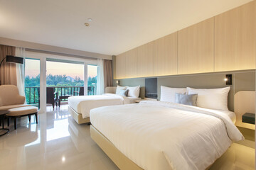 bedroom with two queen-sized beds, contemporary decor.
