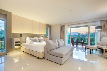 bedroom with two queen-sized beds, contemporary decor.