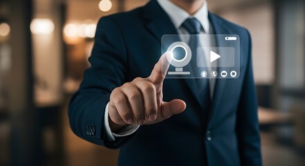 A businessman in a suit points to a digital video interface, interacting with technology.