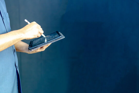  a man in a blue shirt extending his other hand with the palm. This versatile gesture can represent various concepts , making it ideal for business, financial, technological, and conceptual designs.