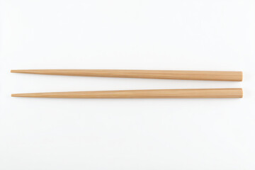 Obraz premium two wooden chopsticks sitting next to each other