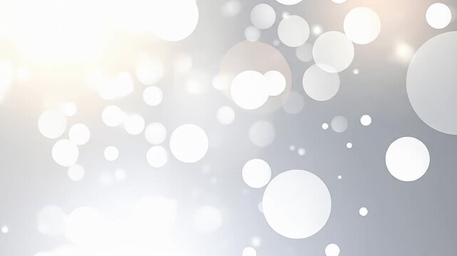 Abstract silver background with white bokeh circles in varying sizes and soft light
