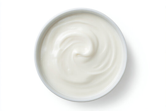 a bowl of yogurt on a white surface
