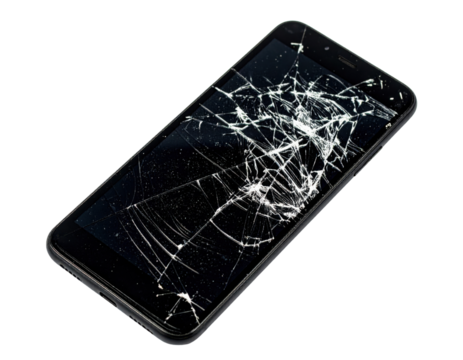 A cracked smartphone screen displaying extensive damage with numerous spiderweb-like fractures.