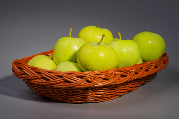 Tasty green summer apple fruit in basket