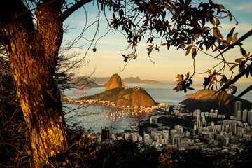 Rio de Janeiro, RJ, Brazil, 08/03/2025 - Sugar Loaf and Urca hills and Botafogo cove at sunset, seen from the Dona Marta viewpoint