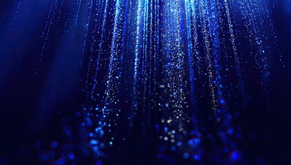 Deep blue abstract digital art.  Streaks of light, like falling glitter, descend against a dark background, with glowing particles