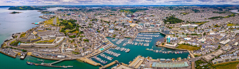Aerial view of Plymouth Hoe and Royal Citadel along the waterfront in Plymouth, England, with cityscape and marina in the background